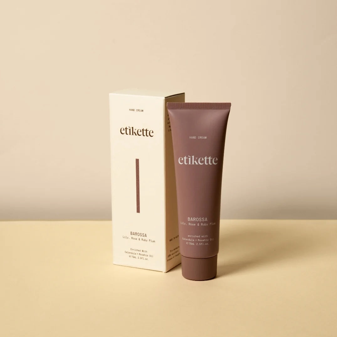 A single tube of Barossa Hand Cream standing upright on a light beige surface against a matching beige background.