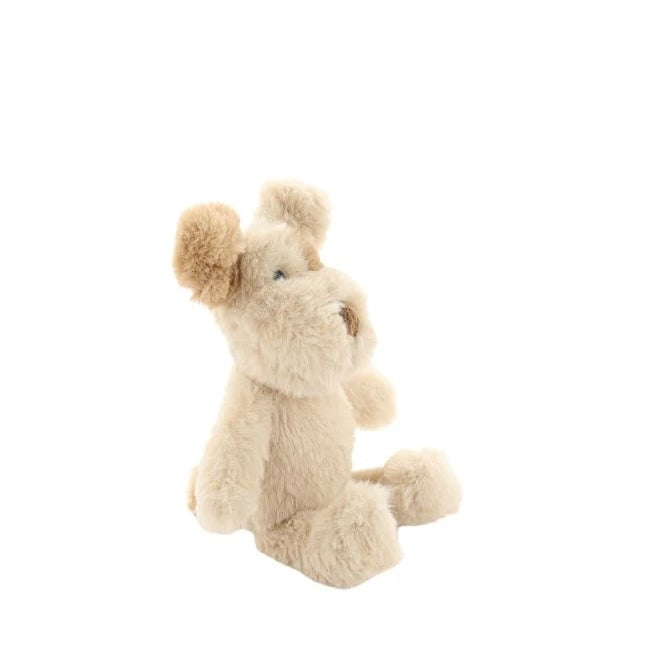 Soft toy in the shape of a dog in cream and honey coloured plush fabric on a white background.