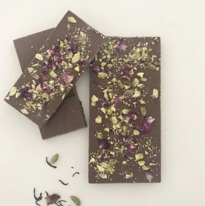 Artisan milk chocolate, chai tea, pistachio and rose petals.