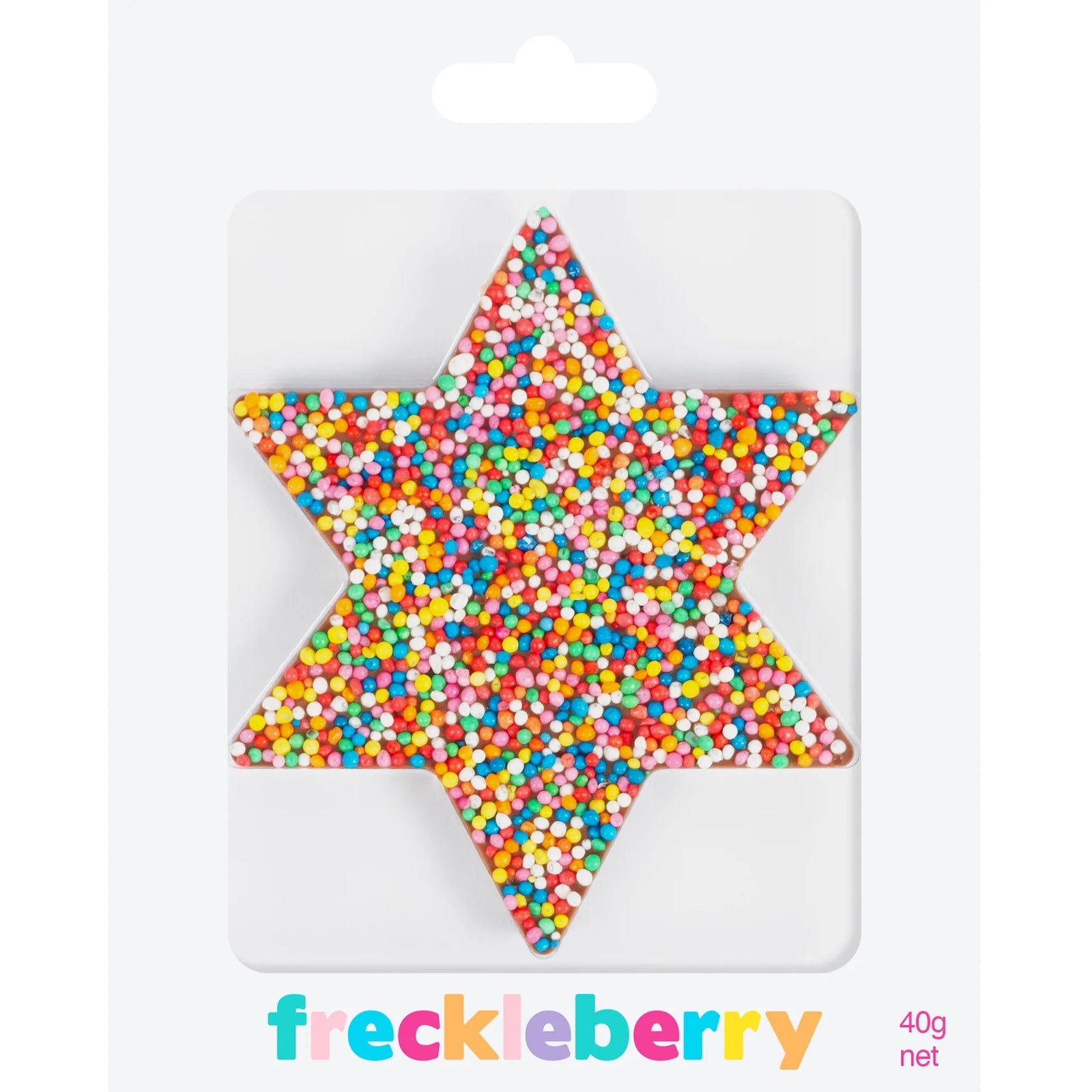 chocolate star covered in freckles on a pink background