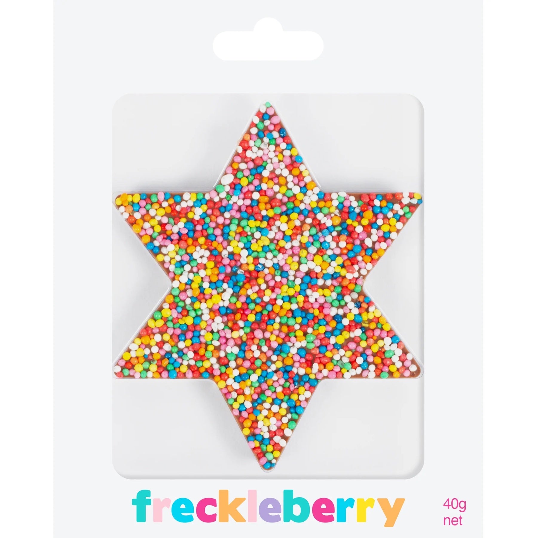 chocolate star covered in freckles on a pink background