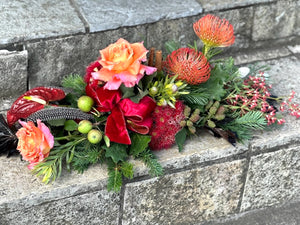 Colourful floral table arrangement on a stone surface