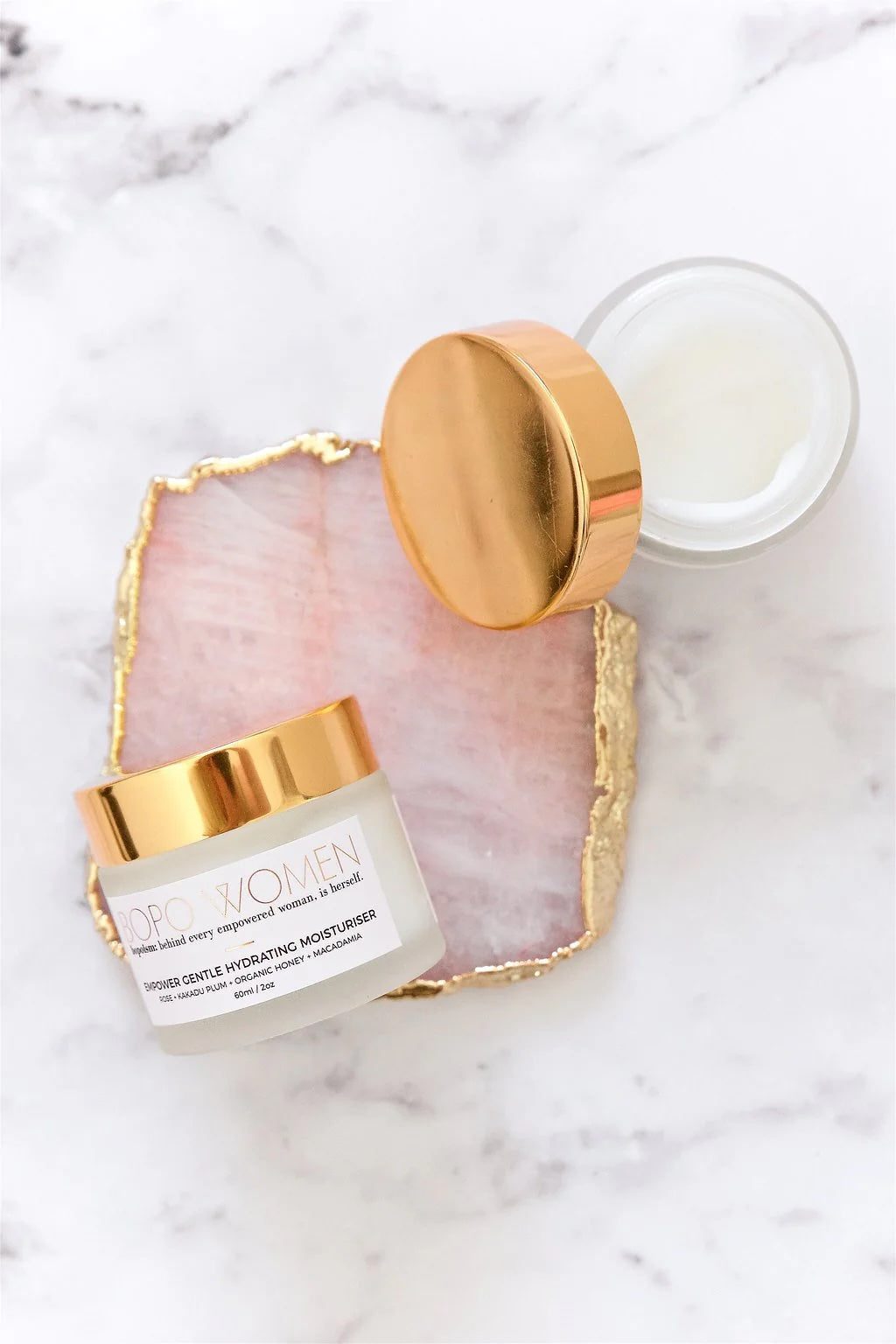 Gentle Hydrating moisturizer jar with gold lid on a white background