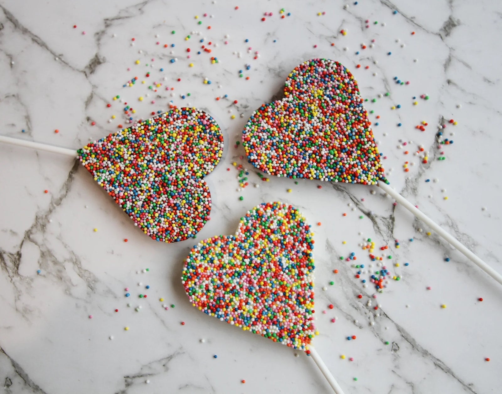Milk chocolate freckle lollipop hearts