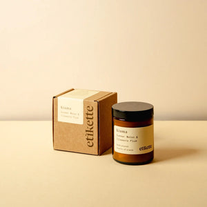 Kiama Candle in a brown glass jar and packaging in a brown cardboard box . 