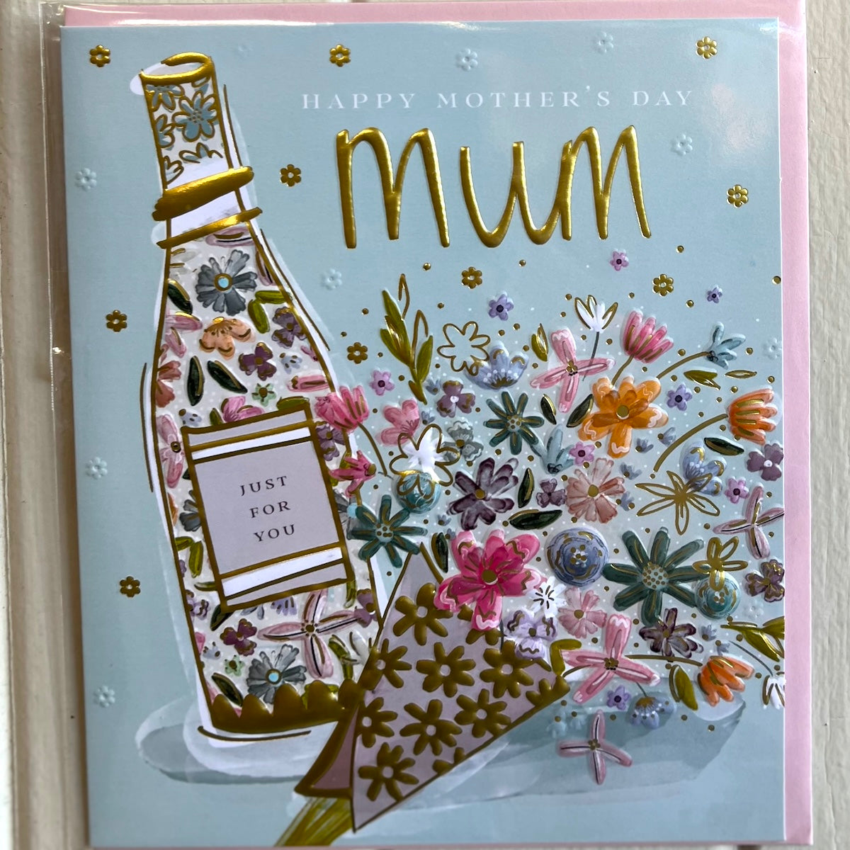 Greeting card with floral design and 'Happy Mother's Day Mum' text on a light blue background.