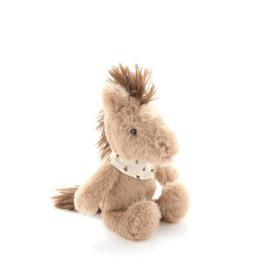Soft horse toy rattle in honey coloured plush fabric with a cream patterned neck bandana on a white background
