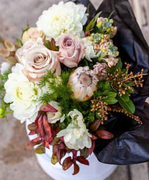 A selection of gorgeous blooms arranged in a hat box. Simply stunning.