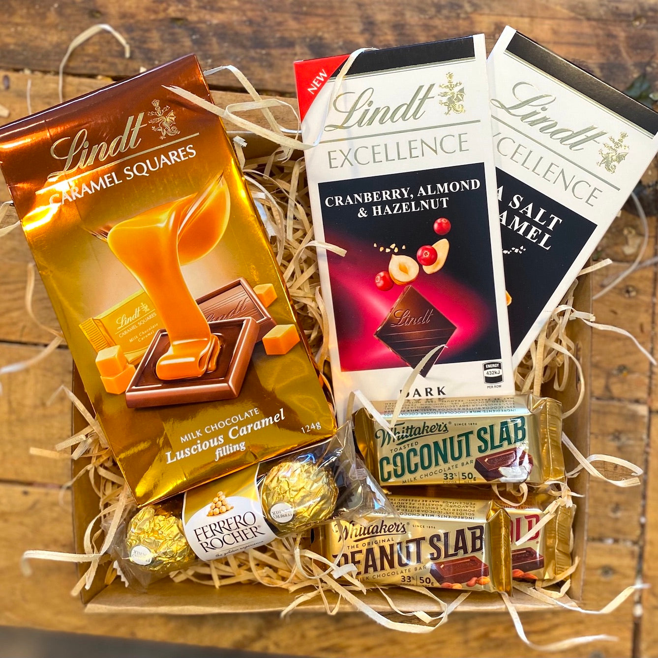 Chocolates and super sweet treat hamper filled with a selection of chocolates, chocolate bars filled with luscious caramel and salted caramel. Beautifully presented in an eco-display gift box. 
