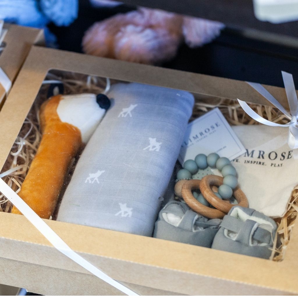 Adorable baby hampers are beautifully presented in an eco-display gift box. Includes a selection of natural beechwood & food grade silicone baby teether, Toy cloth stick rattle and T-bar baby booties. 