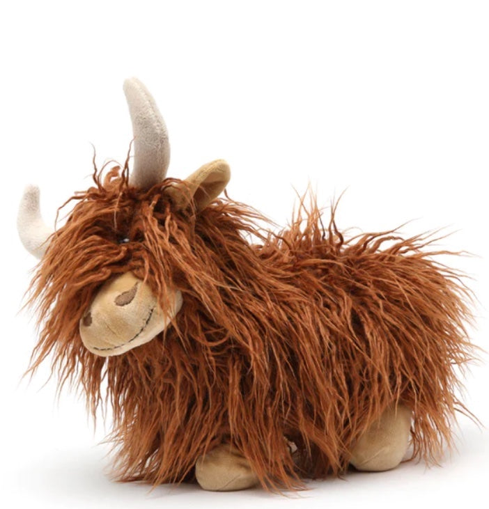 Soft toy in the shape of a female Highland cow.